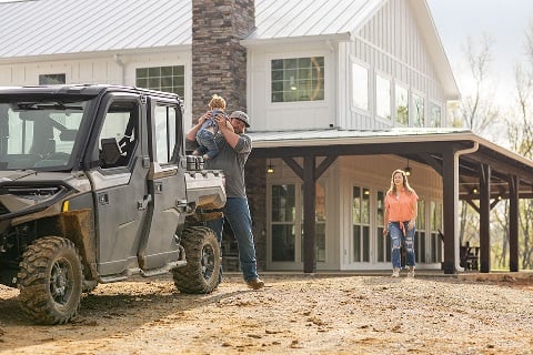 Family checks the progress of their new barndominium construction project