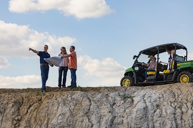 Stroud Family meets with Rural 1st loan officer at the site of their new construction