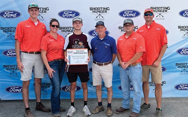 Rural 1st employees presenting scholarship to recipient.