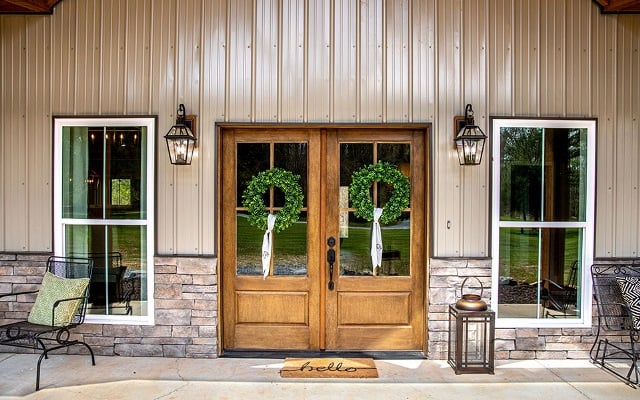 The front door and landing of a barndominium.